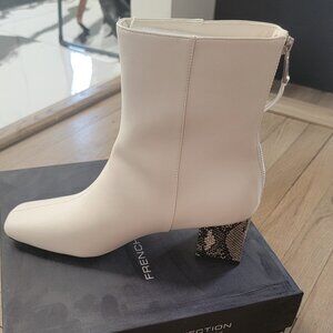 White booties with snakeskin heel